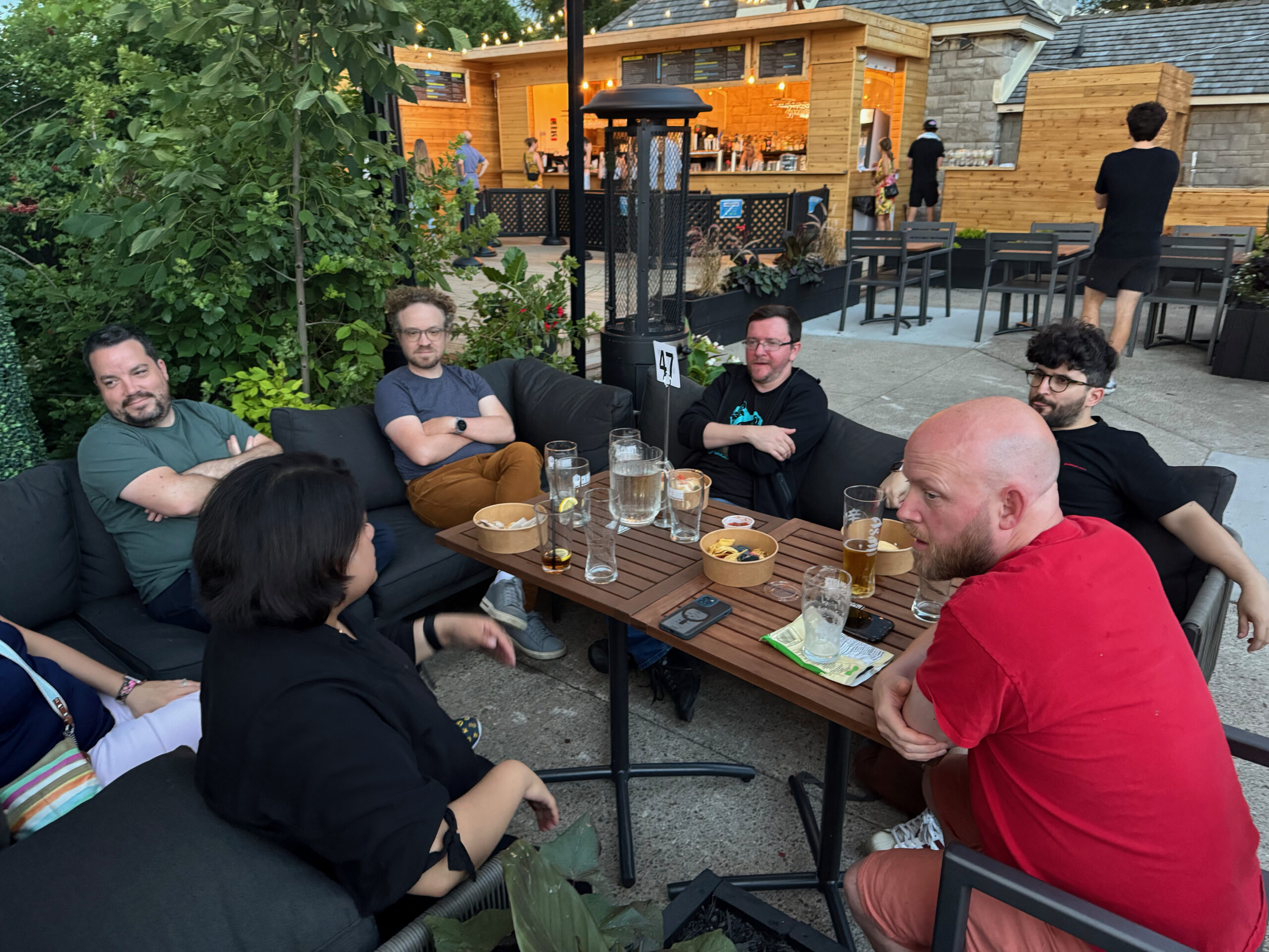 Aurooba, Olivier, Ryan, Evan Herman and Shawn Hooper sit around the table. 