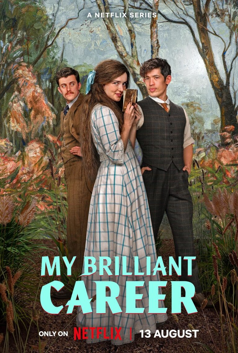 3 women stand shoulder to shoulder with a view of Austrialian woods behind them